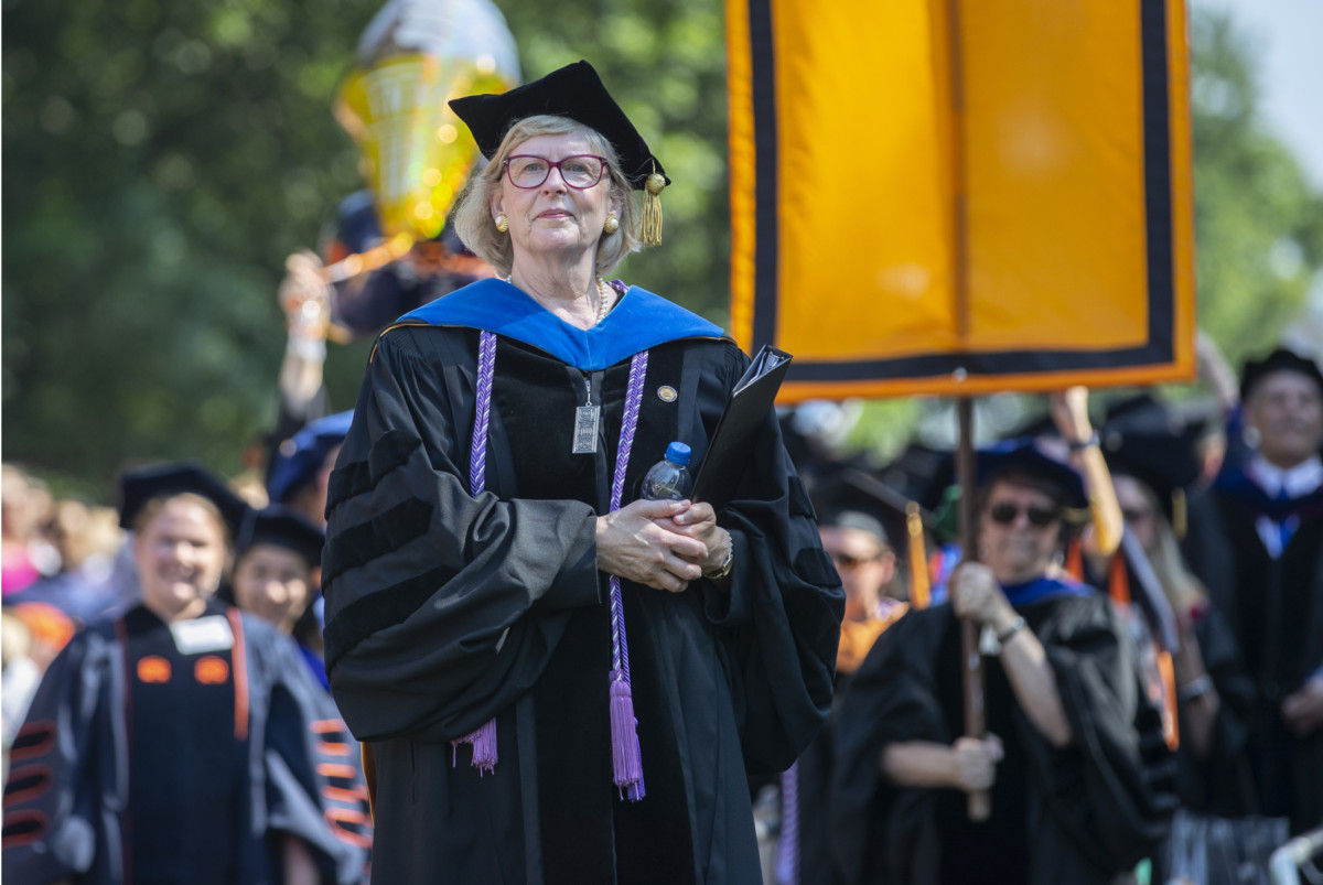 Woman in graduation robes and cap